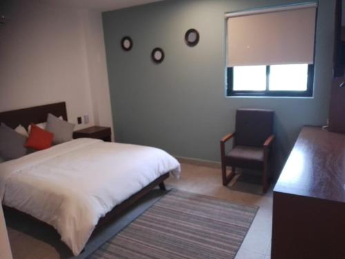 Imagen de la habitación del Hotel Mura Boutique. Foto 20