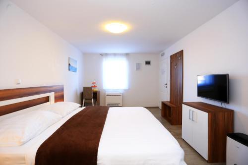 Imagen de la habitación del Hotel Murter. Foto 8