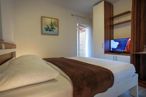 Imagen de la habitación del Hotel Murter. Foto 9