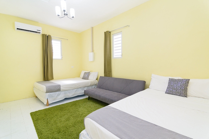 Imagen de la habitación del Hotel Mustique Suites Curacao. Foto 11