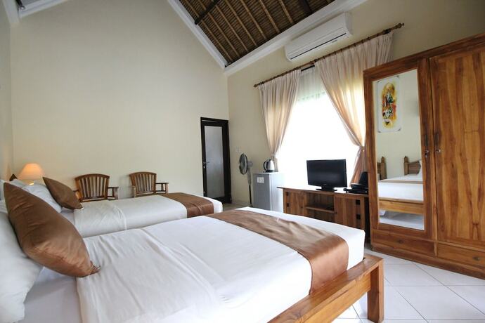 Imagen de la habitación del Hotel Mutiara Bali. Foto 28