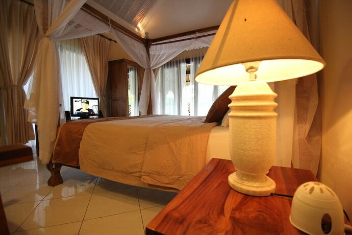 Imagen de la habitación del Hotel Mutiara Bali. Foto 32