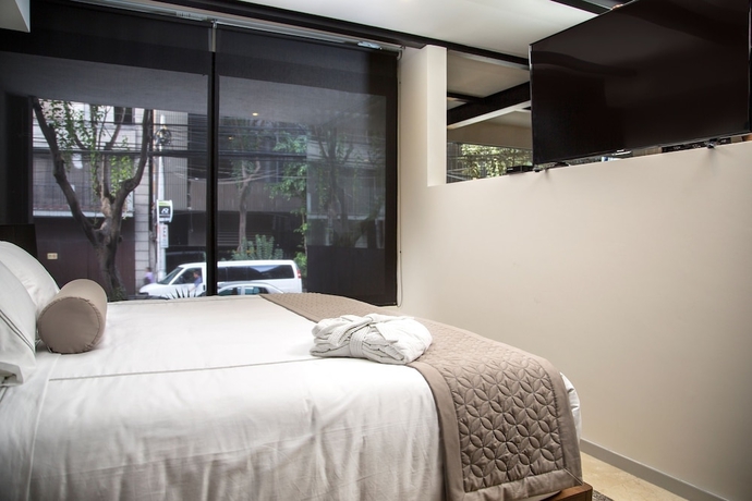 Imagen de la habitación del Hotel Mx Grand Suites. Foto 4