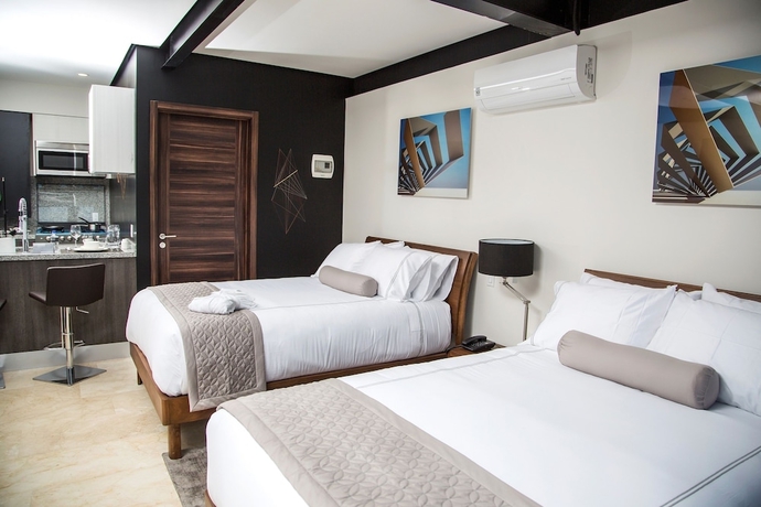 Imagen de la habitación del Hotel Mx Grand Suites. Foto 5