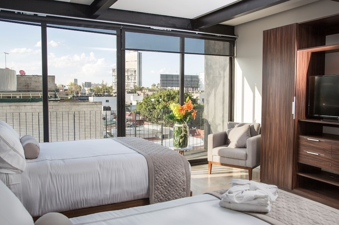 Imagen de la habitación del Hotel Mx Grand Suites. Foto 6