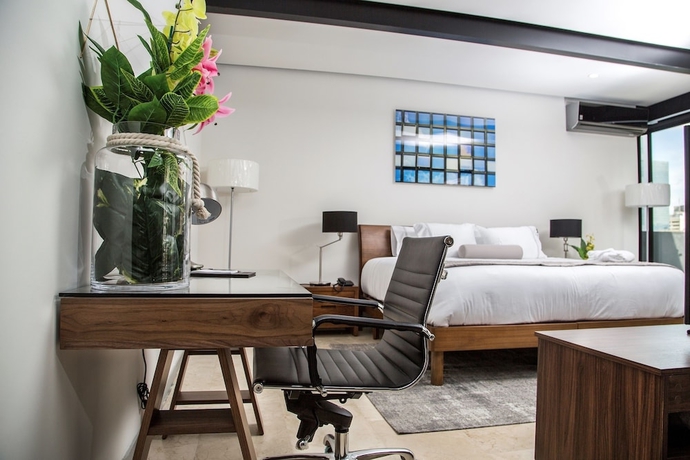 Imagen de la habitación del Hotel Mx Grand Suites. Foto 7