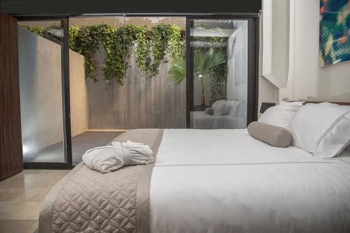 Imagen de la habitación del Hotel Mx Grand Suites. Foto 10