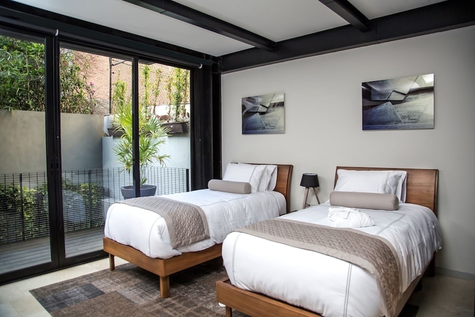 Imagen de la habitación del Hotel Mx Grand Suites. Foto 11