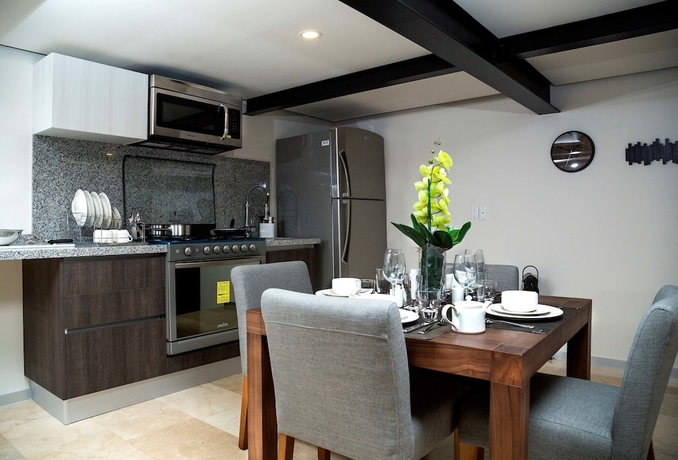 Imagen de la habitación del Hotel Mx Grand Suites. Foto 12