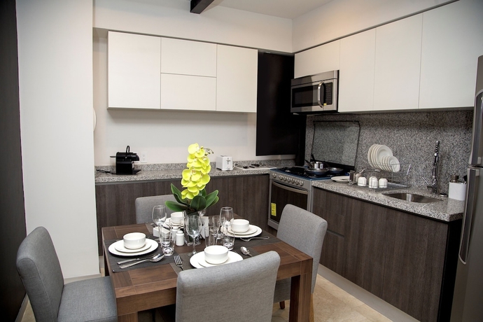 Imagen de la habitación del Hotel Mx Grand Suites. Foto 13