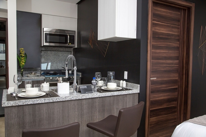 Imagen de la habitación del Hotel Mx Grand Suites. Foto 14