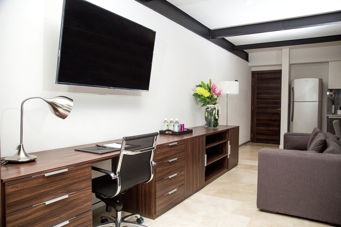 Imagen de la habitación del Hotel Mx Grand Suites. Foto 15