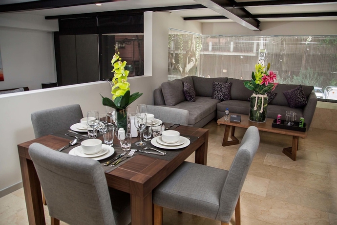 Imagen de la habitación del Hotel Mx Grand Suites. Foto 16