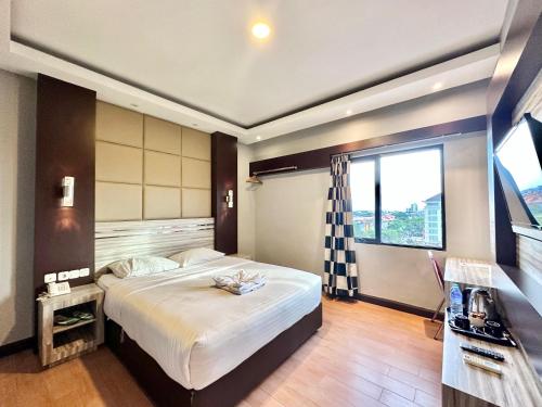 Imagen de la habitación del Hotel My Home Pontianak. Foto 16