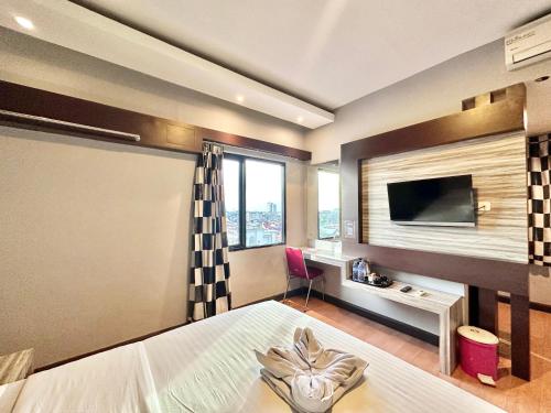 Imagen de la habitación del Hotel My Home Pontianak. Foto 17