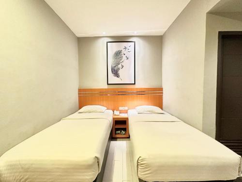 Imagen de la habitación del Hotel My Home Pontianak. Foto 19