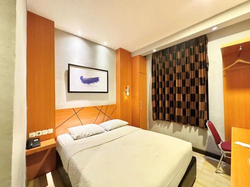 Imagen de la habitación del Hotel My Home Pontianak. Foto 20