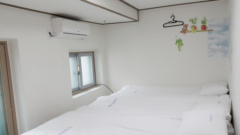 Imagen de la habitación del Hotel Myeongdong Guesthouse. Foto 15