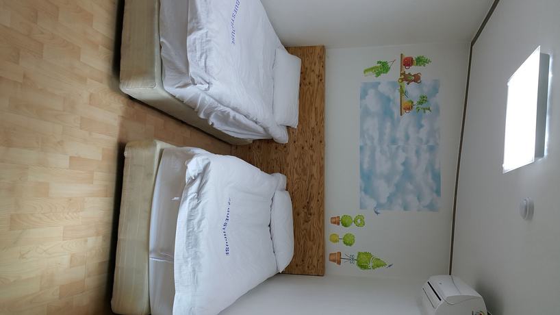 Imagen de la habitación del Hotel Myeongdong Guesthouse. Foto 17
