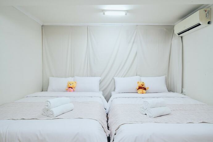 Imagen de la habitación del Hotel Myeongdong Station 2min House. Foto 18