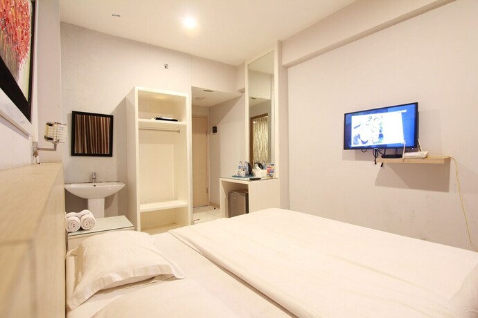 Imagen de la habitación del Hotel Myrooms Bekasi. Foto 21