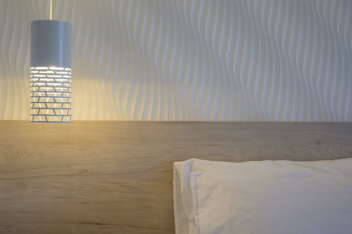 Imagen de la habitación del Hotel Mythos Suites. Foto 8
