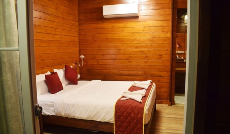 Imagen de la habitación del Hotel N K ECO RESORT. Foto 13