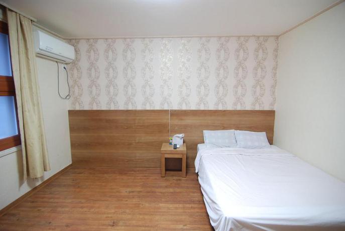 Imagen de la habitación del Hotel NEW WORLD, Jeju. Foto 2