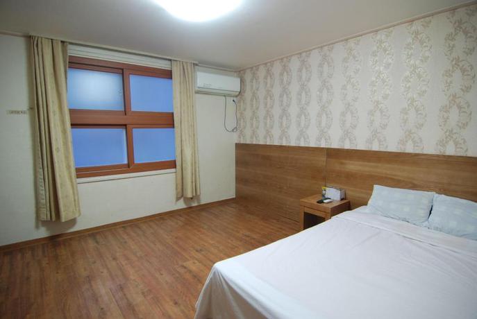 Imagen de la habitación del Hotel NEW WORLD, Jeju. Foto 4