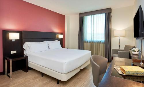 Imagen de la habitación del Hotel NH Coimbra Dona Inês. Foto 16