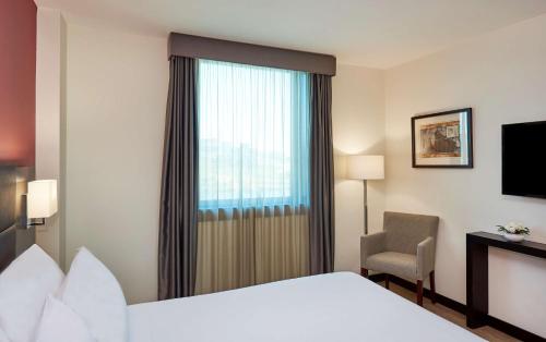 Imagen de la habitación del Hotel NH Coimbra Dona Inês. Foto 19