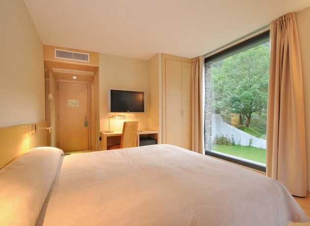 Imagen de la habitación del Hotel NH Collection Andorra Palomé. Foto 8