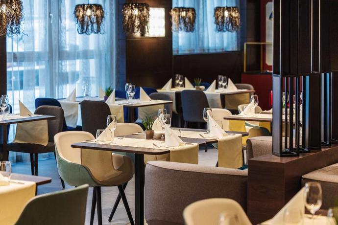 Imagen del bar/restaurante del Hotel NH Collection Salzburg City. Foto 3