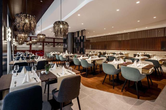 Imagen del bar/restaurante del Hotel NH Collection Salzburg City. Foto 4