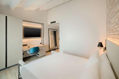 Imagen de la habitación del Hotel NH Collection Venezia Murano Villa. Foto 13