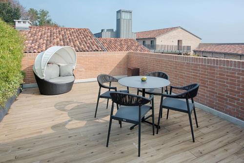 Imagen de la habitación del Hotel NH Collection Venezia Murano Villa. Foto 16