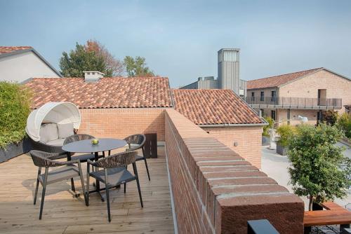 Imagen de la habitación del Hotel NH Collection Venezia Murano Villa. Foto 17