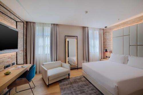 Imagen de la habitación del Hotel NH Collection Venezia Murano Villa. Foto 20