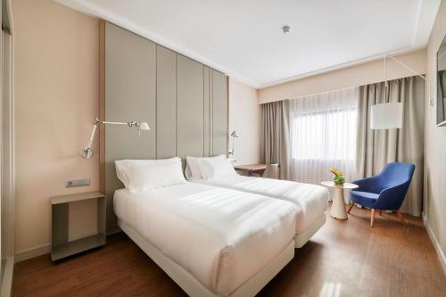 Imagen de la habitación del Hotel NH Lisboa Campo Grande. Foto 13