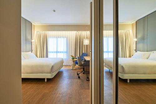 Imagen de la habitación del Hotel NH Lisboa Campo Grande. Foto 14