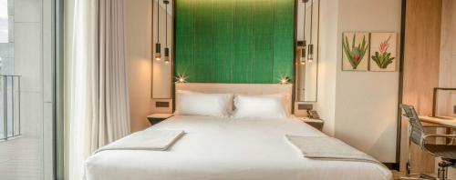 Imagen de la habitación del Hotel NH Porto Jardim. Foto 14