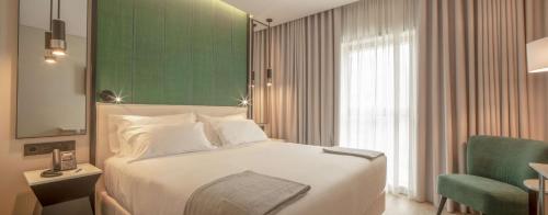 Imagen de la habitación del Hotel NH Porto Jardim. Foto 17