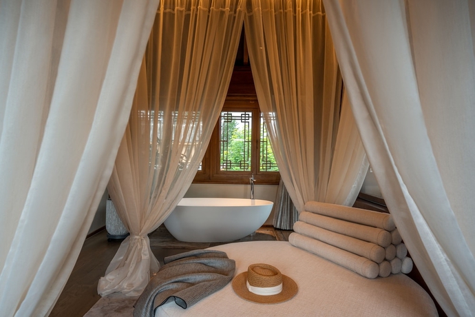 Imagen de la habitación del Hotel NMAN QIANXUE CASTLE. Foto 4
