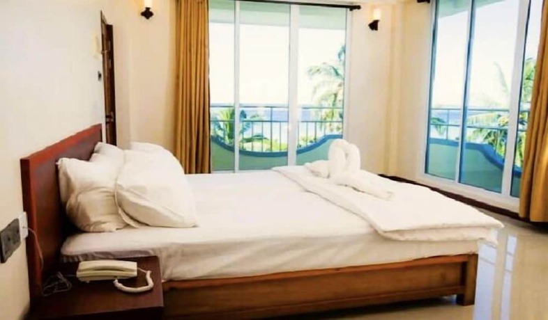 Imagen de la habitación del Hotel NOAH BEACH HOUSE. Foto 4