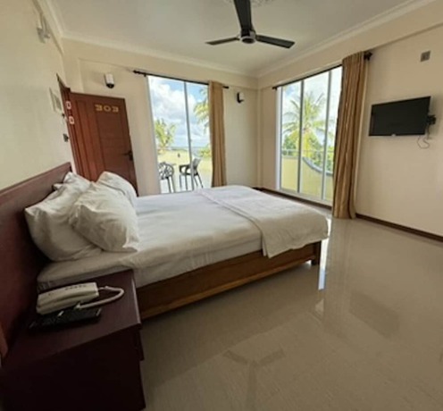 Imagen de la habitación del Hotel NOAH BEACH HOUSE. Foto 6