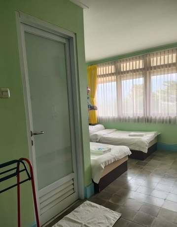 Imagen de la habitación del Hotel NTC Lembang by Kuncara PHM. Foto 7