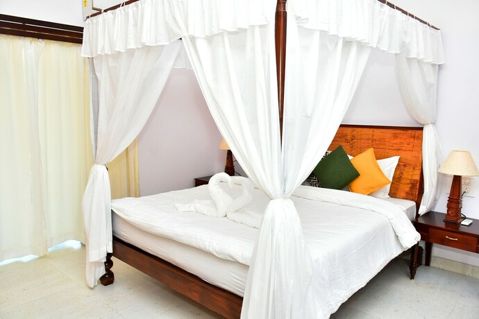 Imagen de la habitación del Hotel Naga Cottages. Foto 12