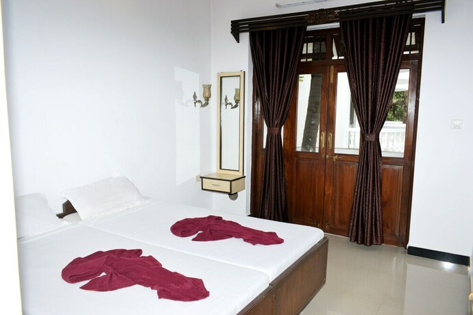 Imagen de la habitación del Hotel Naga Cottages. Foto 18