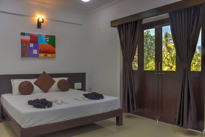 Imagen de la habitación del Hotel Naga Cottages. Foto 25