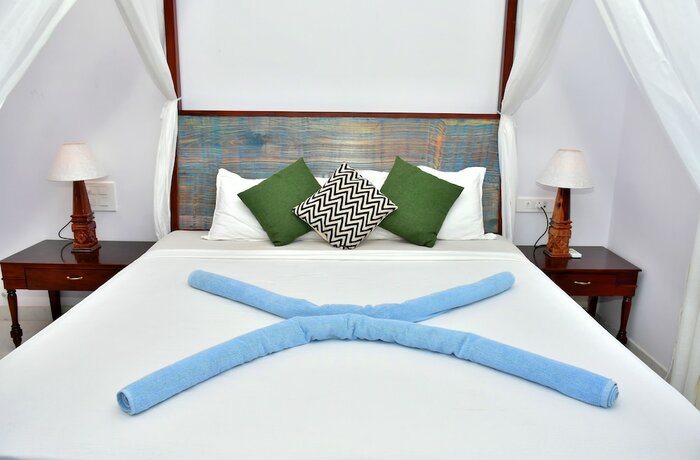 Imagen de la habitación del Hotel Naga Cottages. Foto 26